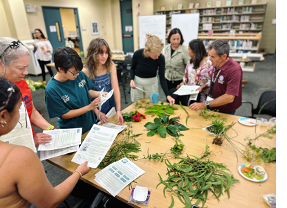 Students identifying Hawaiʻi plant life using tips taught in the Understory Alliance Workshop 